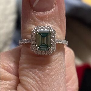 Gorgeous blue moissanite emerald shape diamond.